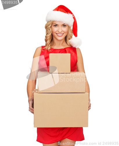 Image of smiling woman in santa helper hat with parcels