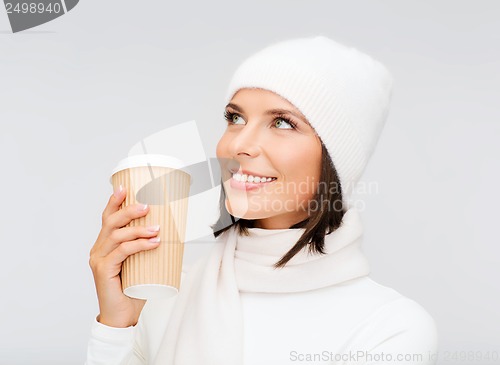 Image of woman in hat with takeaway tea or coffee cup