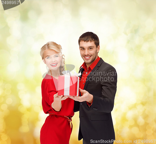 Image of smiling woman and man with gift box