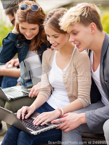 Image of students or teenagers with laptop computers