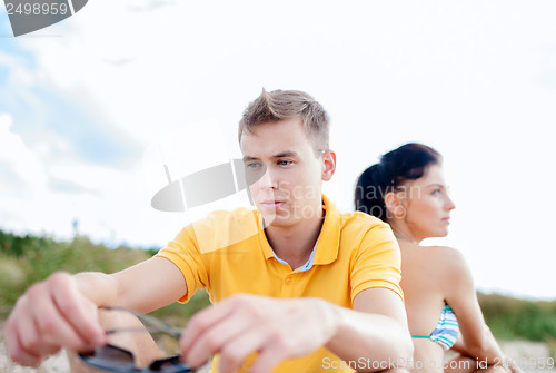 Image of stressed couple outside