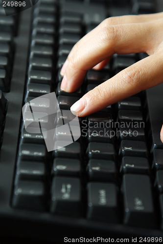 Image of Typing businesswoman