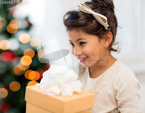 Image of happy child girl with gift box