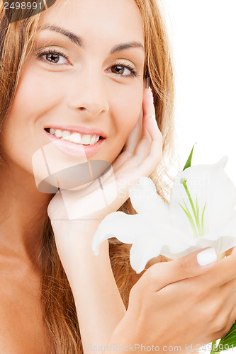 Image of lovely woman with white lily flower