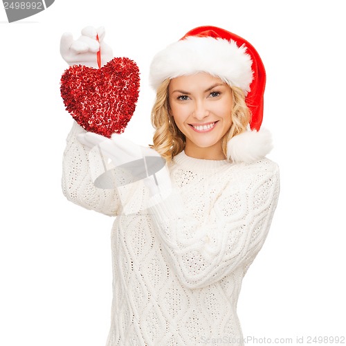 Image of smiling woman in santa helper hat with red heart