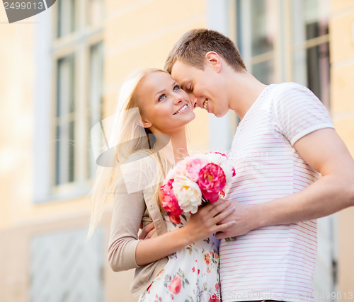 Image of couple with flowers in the city