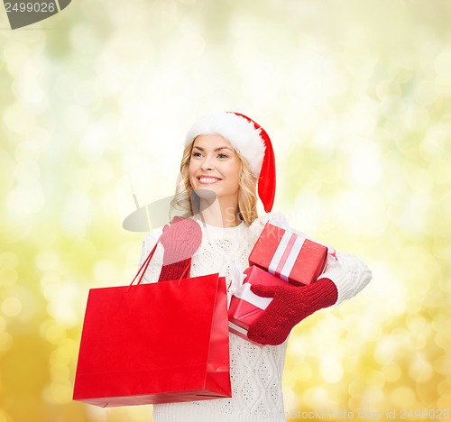 Image of woman in santa helper hat with shopping bags