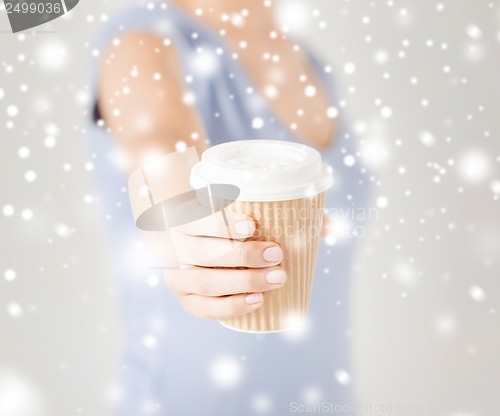 Image of woman hand holding take away coffee cup