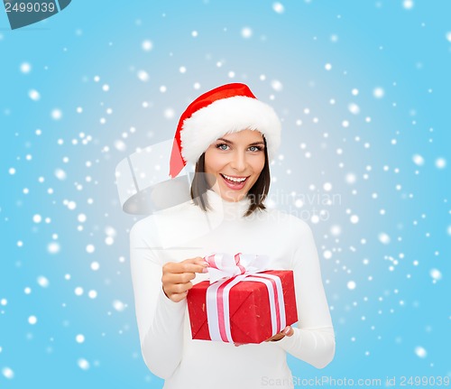 Image of smiling woman in santa helper hat with gift box