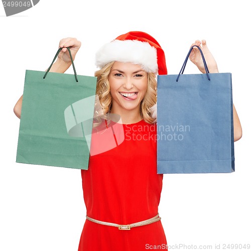 Image of woman in red dress with shopping bags
