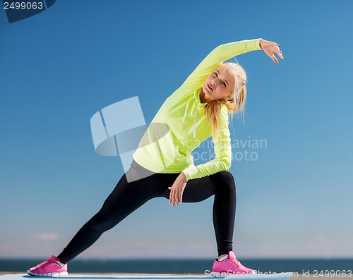 Image of woman doing sports outdoors