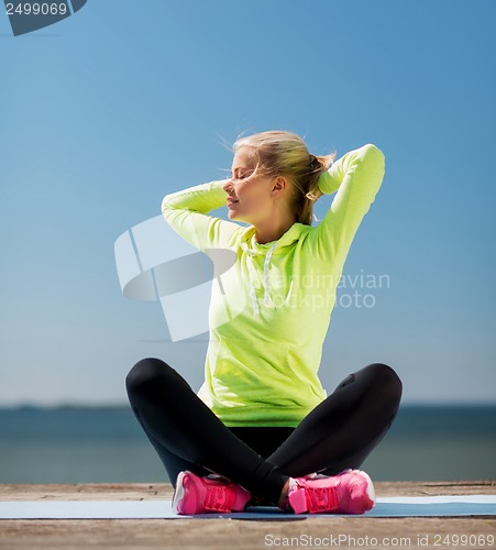 Image of woman doing yoga outdoors