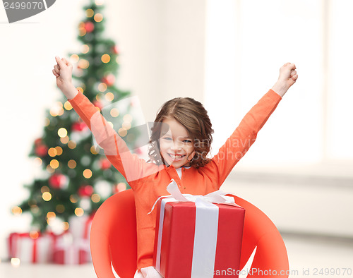 Image of smiling girl with gift box