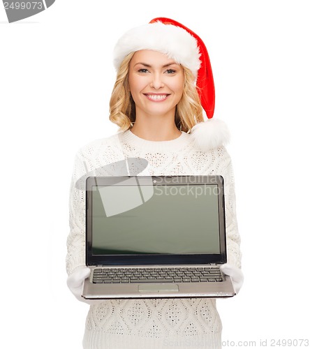 Image of woman in santa helper hat with laptop computer