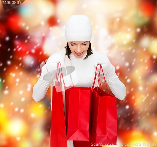 Image of picture of happy woman with shopping bags