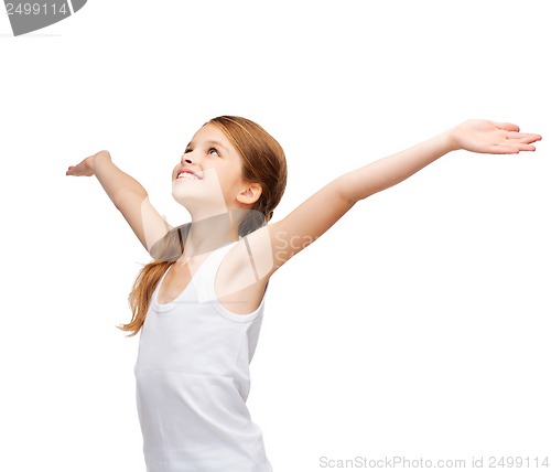 Image of smiling teenage girl with raised hands
