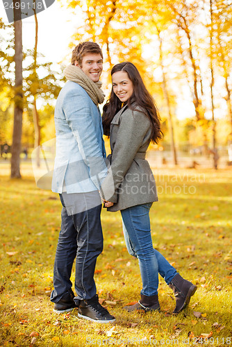 Image of romantic couple in the autumn park