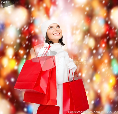 Image of picture of happy woman with shopping bags
