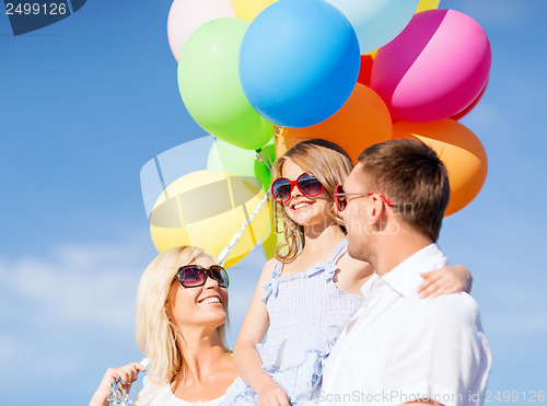Image of family with colorful balloons