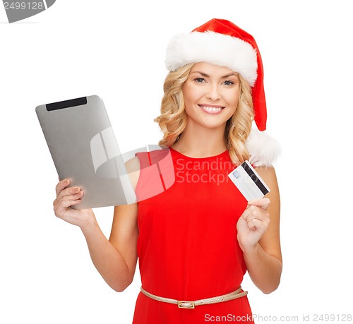 Image of woman with tablet pc and credit card