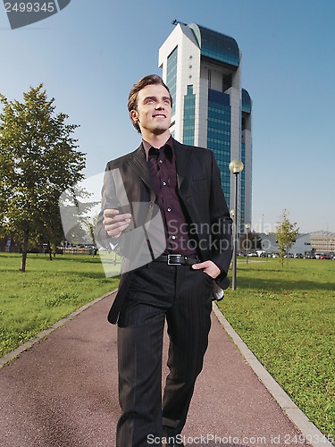 Image of Businessman working near office ad