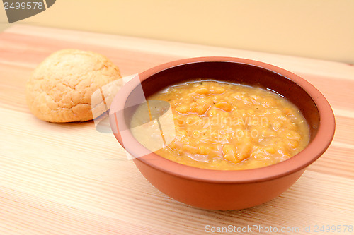 Image of Chunky vegetable soup with a bread roll