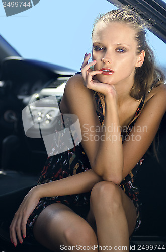 Image of woman in the black car 