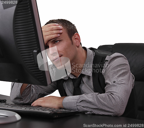 Image of Unhappy Young Man in Front of the Computer