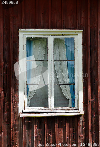 Image of Old window with curtains, typical Swedish style 