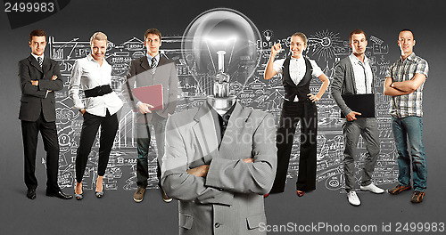 Image of Business Team With Lamp Head