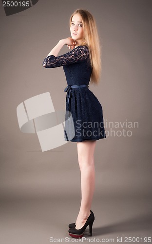 Image of Sexy slim woman in black dress