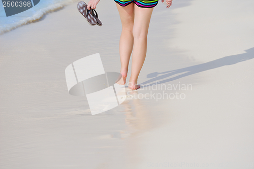 Image of beautiful gril on beach have fun