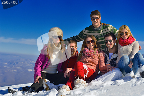 Image of friends have fun at winter on fresh snow