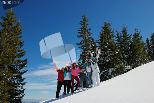 Image of friends have fun at winter on fresh snow