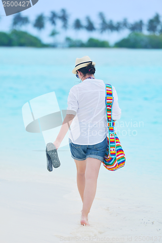 Image of beautiful gril on beach have fun