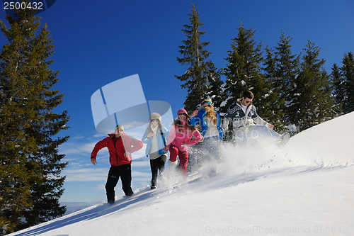 Image of friends have fun at winter on fresh snow