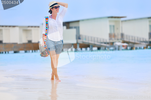 Image of beautiful gril on beach have fun