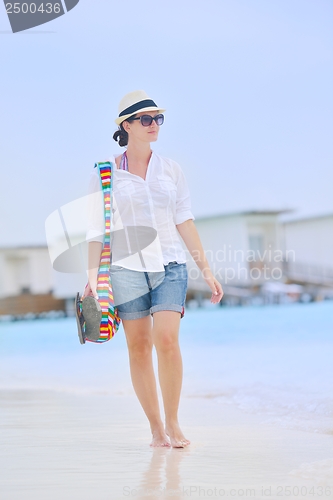 Image of beautiful gril on beach have fun