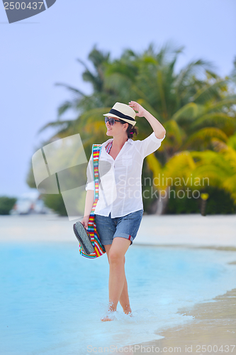 Image of beautiful gril on beach have fun