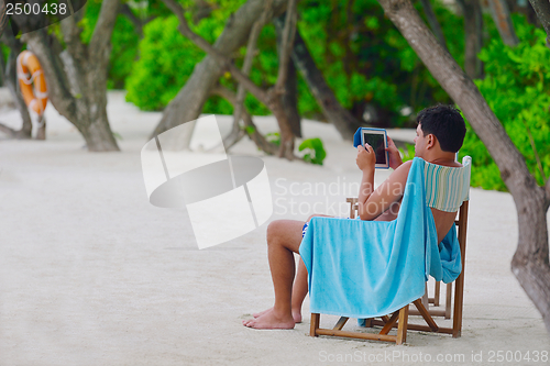 Image of beautiful gril on beach have fun