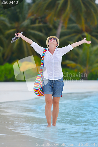 Image of beautiful gril on beach have fun