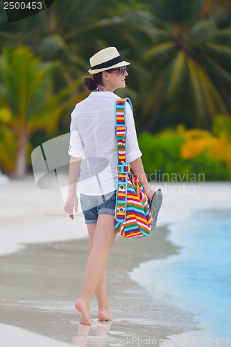 Image of beautiful gril on beach have fun