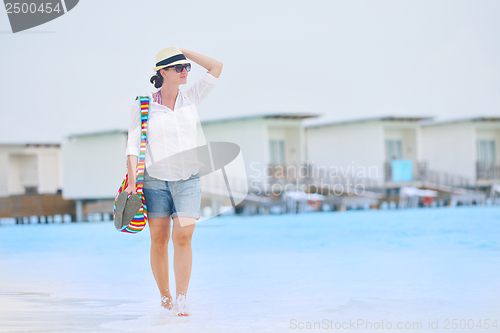 Image of beautiful gril on beach have fun