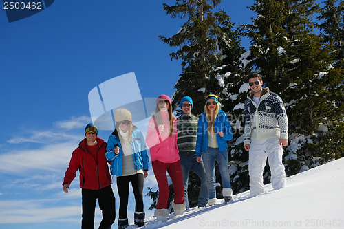 Image of friends have fun at winter on fresh snow