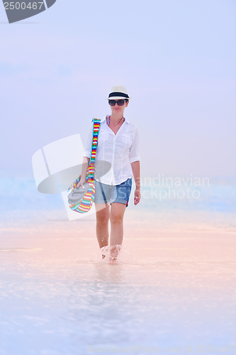 Image of beautiful gril on beach have fun