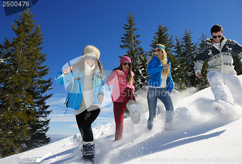 Image of friends have fun at winter on fresh snow