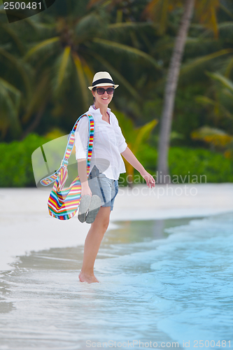 Image of beautiful gril on beach have fun