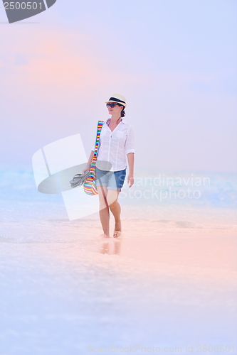 Image of beautiful gril on beach have fun