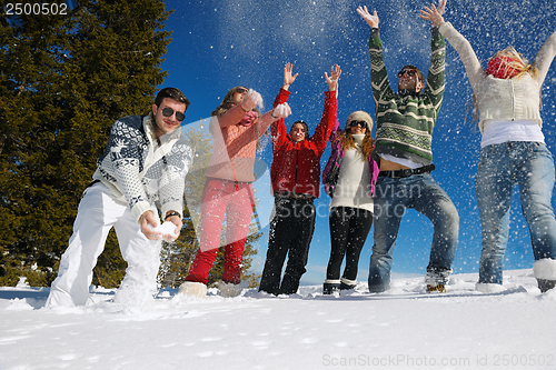 Image of friends have fun at winter on fresh snow