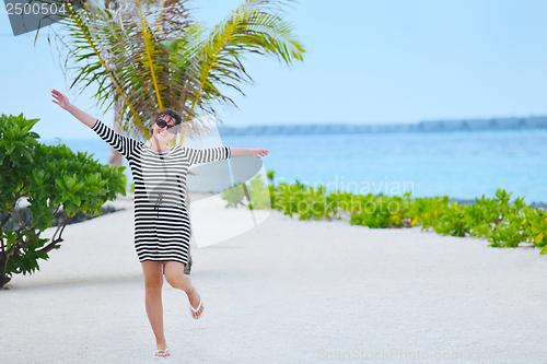 Image of beautiful gril on beach have fun